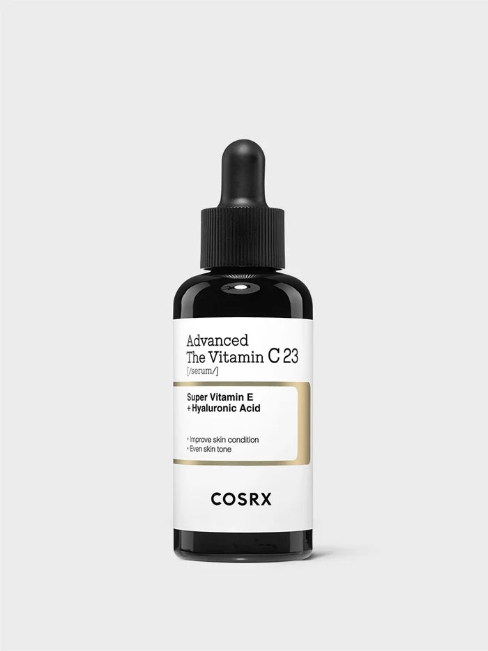 COSRX Advanced The Vitamin C 23 Serum bottle featuring Super Vitamin E and Hyaluronic Acid; high-potency 23% stabilized Vitamin C formulation designed to brighten dull skin, refine pores, and even skin tone while hydrating; minimal modern K-beauty packaging emphasizing clinical-grade clarity and gentle brightening care.